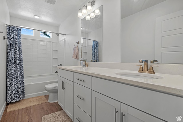 217 S Buckhorn Bath Ave W, Saratoga Springs, UT 84045 - bathroom featuring double vanity, a sink, toilet, and wood finished floors