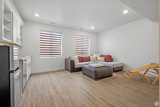217 S Buckhorn Bath Ave W, Saratoga Springs, UT 84045 - living area featuring light wood-style flooring, recessed lighting, baseboards, and visible vents