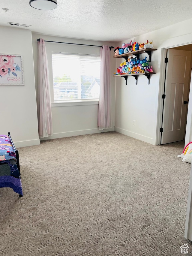 1807 S Bridle Path Loop, Lehi, UT 84043 - unfurnished bedroom with a textured ceiling, baseboards, visible vents, and carpet