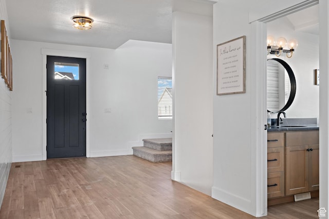 1807 S Bridle Path Loop, Lehi, UT 84043 - foyer with a notable chandelier, light wood-type flooring, baseboards, and stairs