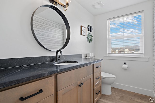 1807 S Bridle Path Loop, Lehi, UT 84043 - bathroom with baseboards, vanity, toilet, and wood finished floors