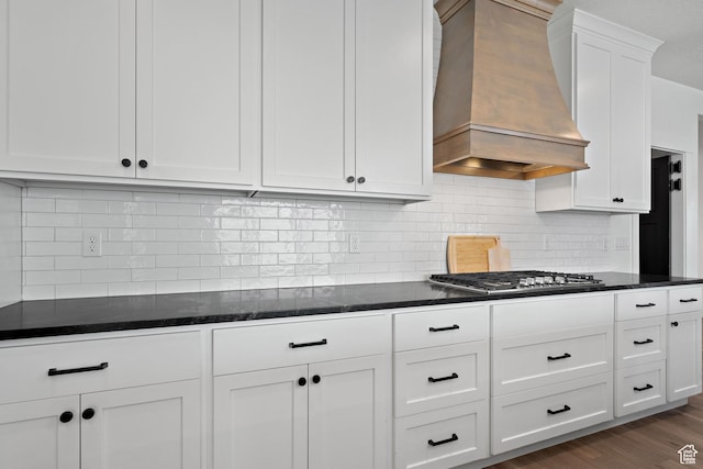 1807 S Bridle Path Loop, Lehi, UT 84043 - kitchen with stainless steel gas cooktop, white cabinetry, premium range hood, dark stone countertops, and backsplash