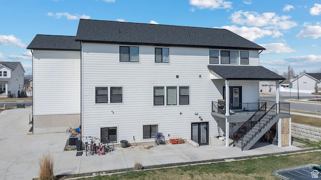 1807 S Bridle Path Loop, Lehi, UT 84043 - rear view of house with central air condition unit, stairs, a patio area, a residential view, and roof with shingles