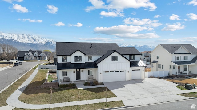 1807 S Bridle Path Loop, Lehi, UT 84043 - modern farmhouse featuring a standing seam roof, fence, covered porch, an attached garage, and a residential view