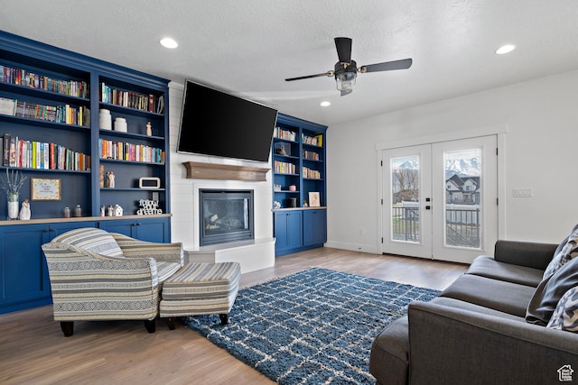 1807 S Bridle Path Loop, Lehi, UT 84043 - living room featuring a ceiling fan, recessed lighting, a textured ceiling, wood finished floors, and a fireplace