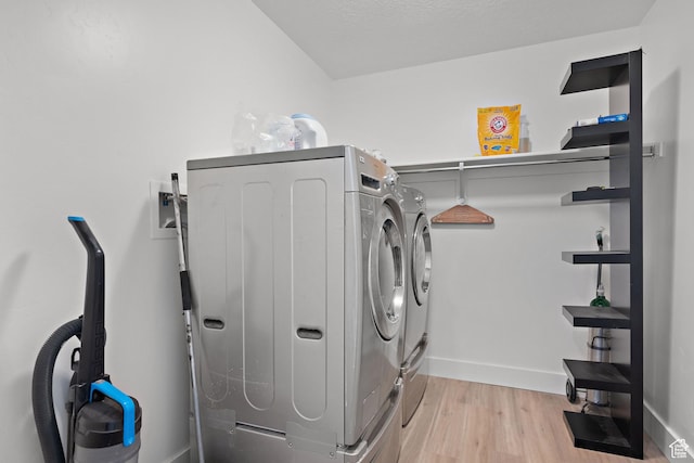 1807 S Bridle Path Loop, Lehi, UT 84043 - laundry room with light wood finished floors, laundry area, independent washer and dryer, and baseboards