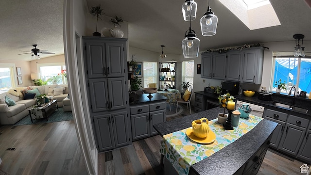 102 W Alta View Way Unit 7, Sandy, UT 84070 - kitchen featuring a ceiling fan, gray cabinetry, and wood finished floors