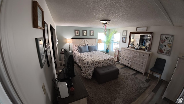 102 W Alta View Way Unit 7, Sandy, UT 84070 - bedroom with dark wood-type flooring and a textured ceiling