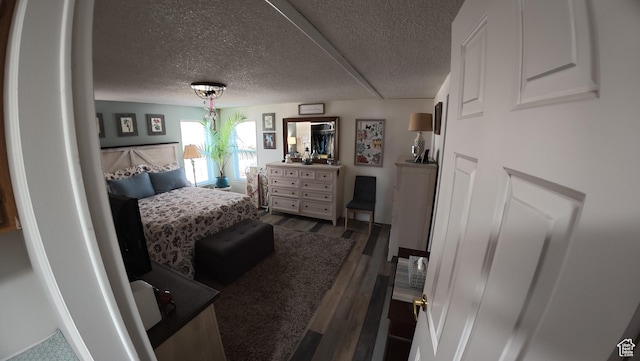 102 W Alta View Way Unit 7, Sandy, UT 84070 - bedroom featuring dark wood-style flooring and a textured ceiling