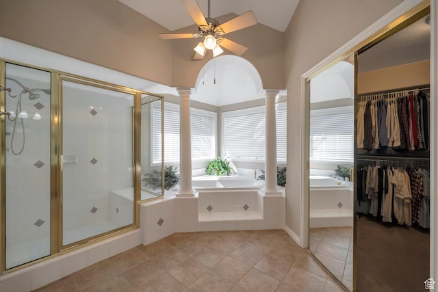 full bathroom with ornate columns, a wealth of natural light, a shower stall, and a bath