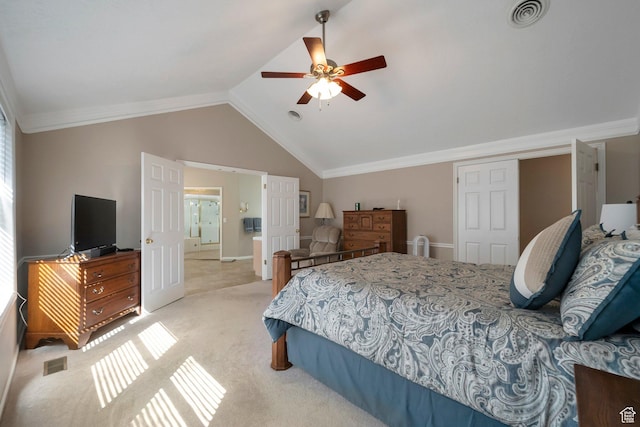 bedroom featuring visible vents, vaulted ceiling, crown molding, and light colored carpet