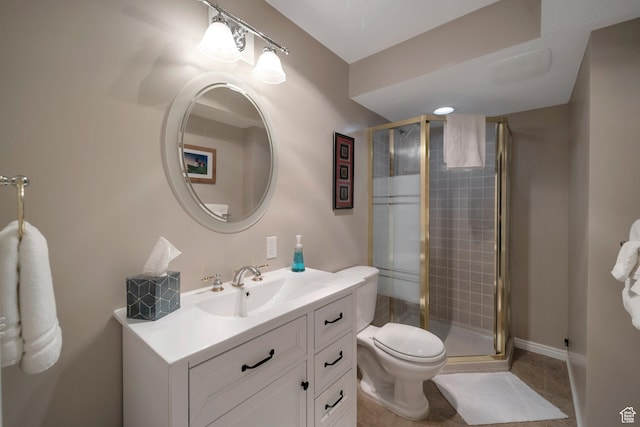 full bath with a stall shower, tile patterned floors, toilet, and vanity