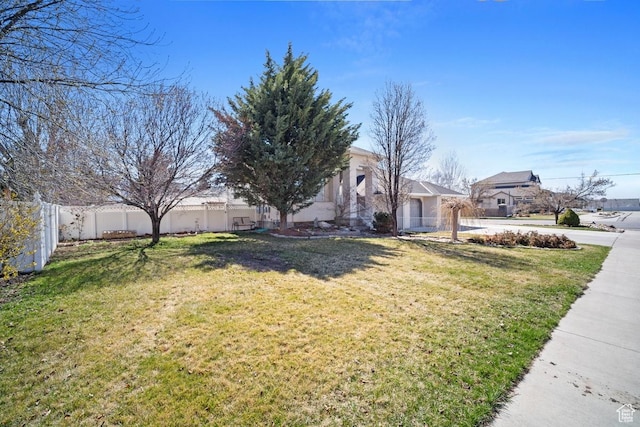 28 E 1400 N, Mapleton, UT 84664 - view of front of property featuring concrete driveway, stucco siding, fence, a front yard, and a garage
