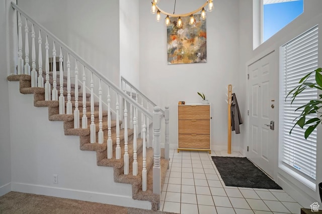 28 E 1400 N, Mapleton, UT 84664 - entryway with baseboards, stairs, a high ceiling, and tile patterned floors