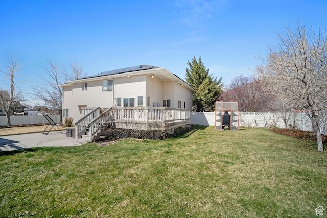 28 E 1400 N, Mapleton, UT 84664 - rear view of property featuring roof mounted solar panels, a patio, a fenced backyard, a deck, and a lawn