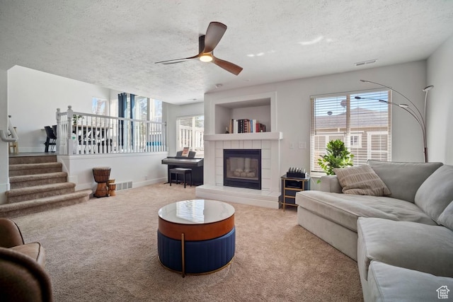 28 E 1400 N, Mapleton, UT 84664 - carpeted living area with a textured ceiling, visible vents, and a healthy amount of sunlight