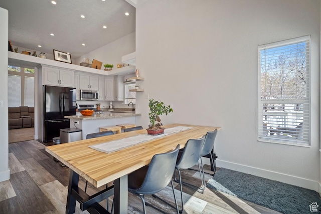 28 E 1400 N, Mapleton, UT 84664 - dining area featuring baseboards, wood finished floors, a towering ceiling, and recessed lighting