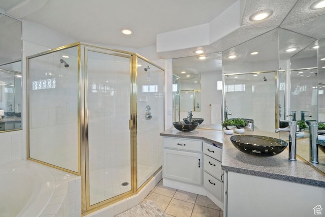 28 E 1400 N, Mapleton, UT 84664 - full bathroom with a shower stall, tile patterned floors, recessed lighting, vanity, and a garden tub