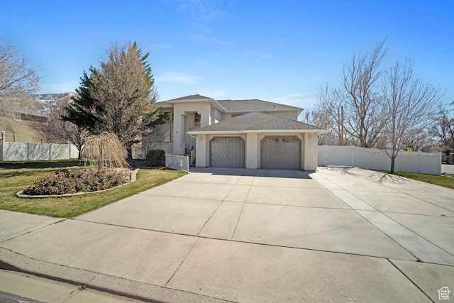 28 E 1400 N, Mapleton, UT 84664 - view of front of home with fence, stucco siding, an attached garage, and concrete driveway