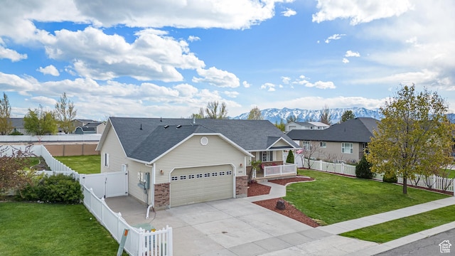 444 E 2720 N, North Logan, UT 84341 - view of front of house featuring an attached garage, covered porch, concrete driveway, a residential view, and brick siding