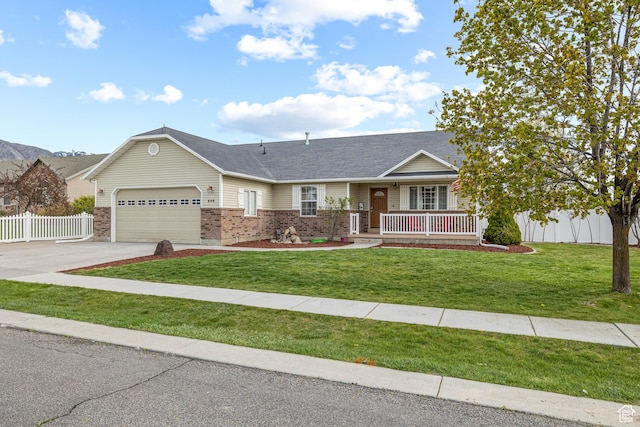 444 E 2720 N, North Logan, UT 84341 - ranch-style house with brick siding, covered porch, a garage, driveway, and roof with shingles