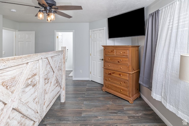 444 E 2720 N, North Logan, UT 84341 - bedroom with dark wood-style flooring, baseboards, a ceiling fan, and a closet
