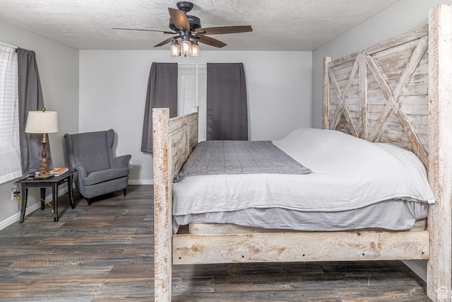 444 E 2720 N, North Logan, UT 84341 - bedroom with wood finished floors, a textured ceiling, baseboards, and a ceiling fan