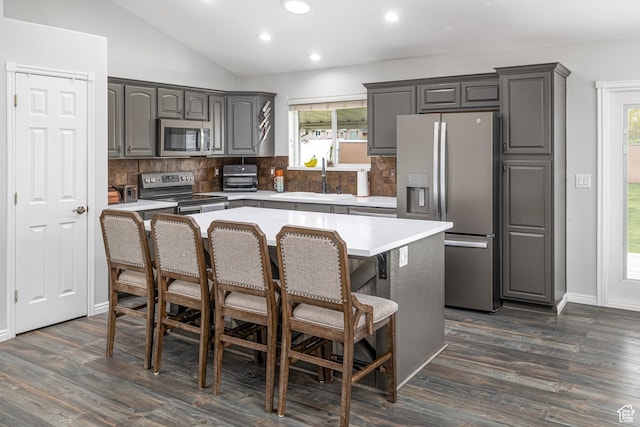 444 E 2720 N, North Logan, UT 84341 - kitchen featuring stainless steel appliances, a sink, recessed lighting, backsplash, and a kitchen breakfast bar