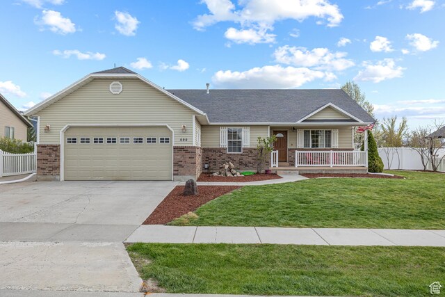 444 E 2720 N, North Logan, UT 84341 - single story home with brick siding, an attached garage, a porch, concrete driveway, and roof with shingles