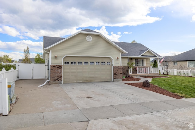 444 E 2720 N, North Logan, UT 84341 - craftsman-style house featuring brick siding, a porch, a gate, and a garage