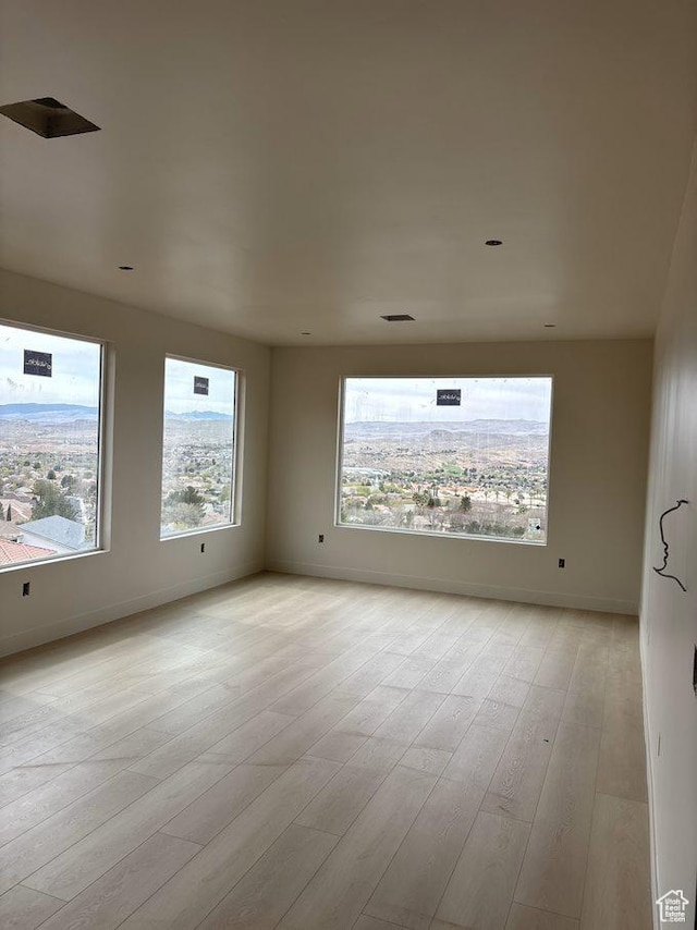 438 N Stone Mountain Dr Unit 25, St George, UT 84770 - empty room with baseboards and light wood-type flooring