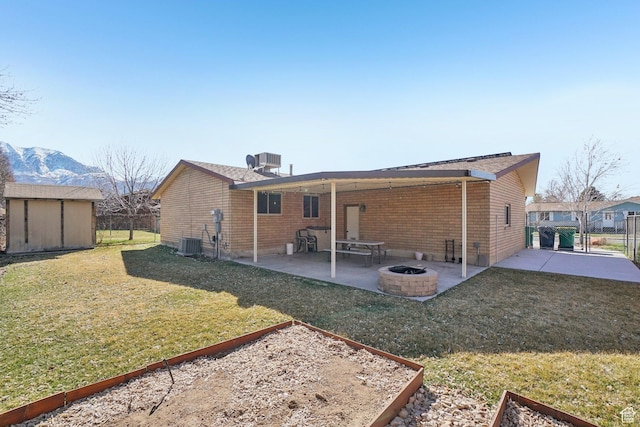 240 W 220 S, Orem, UT 84058 - back of property with an outdoor structure, a patio, a storage unit, a vegetable garden, and a fire pit
