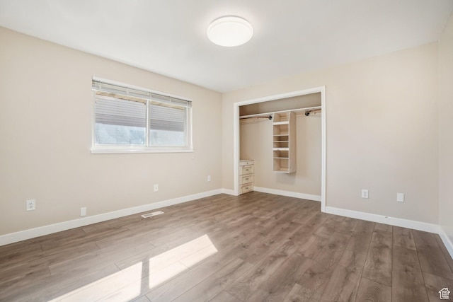 240 W 220 S, Orem, UT 84058 - unfurnished bedroom with baseboards, visible vents, a closet, and wood finished floors
