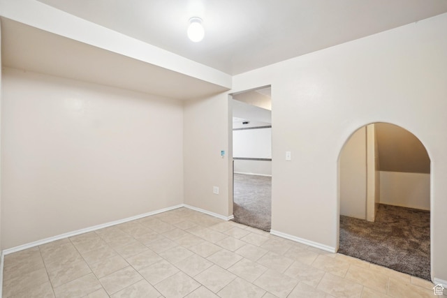 240 W 220 S, Orem, UT 84058 - unfurnished room with arched walkways, baseboards, light tile patterned floors, and light colored carpet