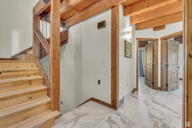 2421 S Navajo Unit Pi-C50, Coalville, UT 84017 - stairs featuring marble finish floor, baseboards, beamed ceiling, and visible vents