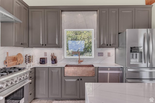2421 S Navajo Unit Pi-C50, Coalville, UT 84017 - kitchen featuring tasteful backsplash, appliances with stainless steel finishes, under cabinet range hood, a sink, and gray cabinetry