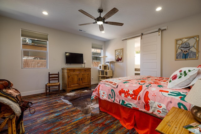 533 E Cutter Trl, Kanab, UT 84741 - bedroom with recessed lighting, baseboards, a barn door, visible vents, and wood finished floors