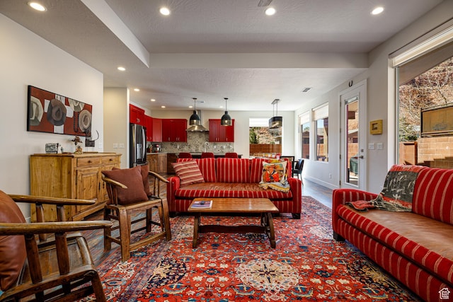 533 E Cutter Trl, Kanab, UT 84741 - living room with baseboards, dark carpet, recessed lighting, and a textured ceiling