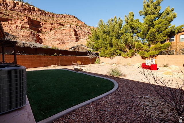 533 E Cutter Trl, Kanab, UT 84741 - view of yard featuring cooling unit and a fenced backyard