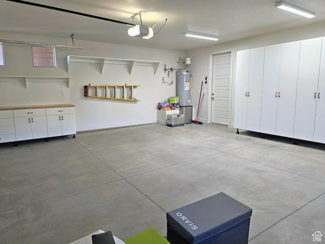 533 E Cutter Trl, Kanab, UT 84741 - garage with water heater, baseboards, and a garage door opener