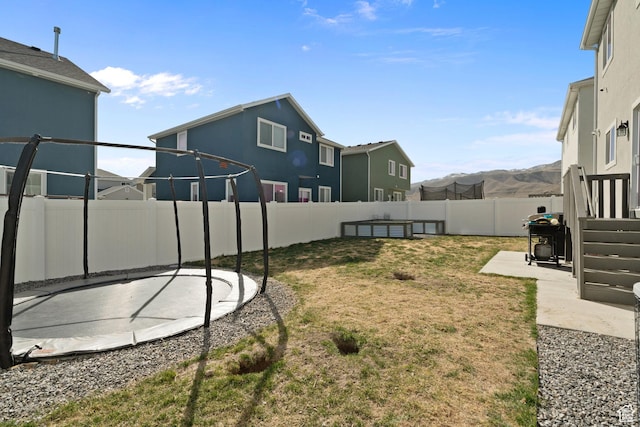 7016 N Amber Mead Ave, Eagle Mountain, UT 84005 - view of yard with a fenced backyard and a patio area