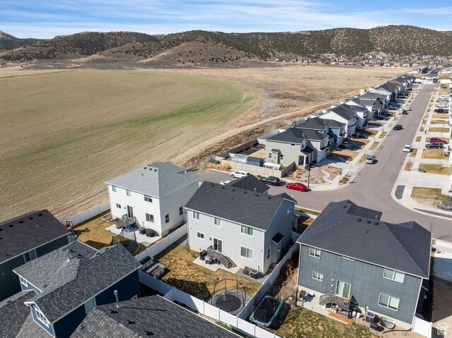 7016 N Amber Mead Ave, Eagle Mountain, UT 84005 - drone / aerial view featuring a residential view and a mountain view