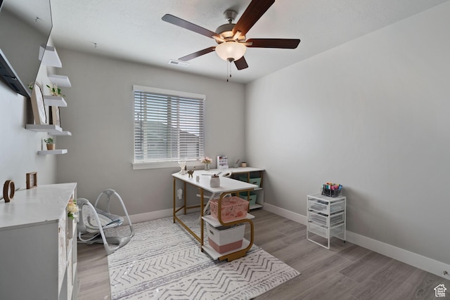 7016 N Amber Mead Ave, Eagle Mountain, UT 84005 - office space with baseboards, a ceiling fan, and light wood finished floors