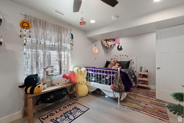 7016 N Amber Mead Ave, Eagle Mountain, UT 84005 - bedroom with baseboards, visible vents, a ceiling fan, and wood finished floors