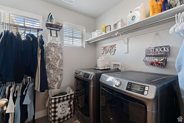 7016 N Amber Mead Ave, Eagle Mountain, UT 84005 - washroom featuring washing machine and dryer, visible vents, and laundry area