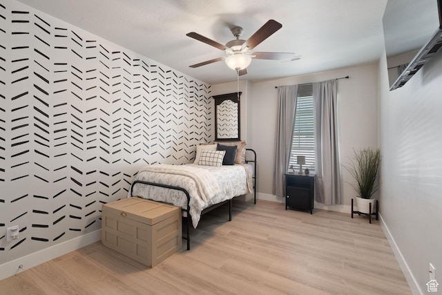 7016 N Amber Mead Ave, Eagle Mountain, UT 84005 - bedroom with ceiling fan, baseboards, an accent wall, and light wood-type flooring