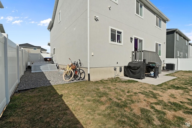 7016 N Amber Mead Ave, Eagle Mountain, UT 84005 - rear view of house featuring a patio, a fenced backyard, a lawn, and cooling unit