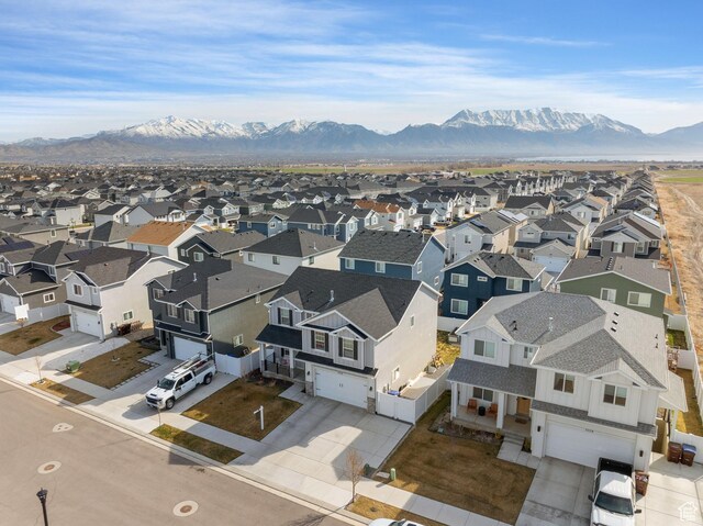 7016 N Amber Mead Ave, Eagle Mountain, UT 84005 - drone / aerial view featuring a mountain view and a residential view