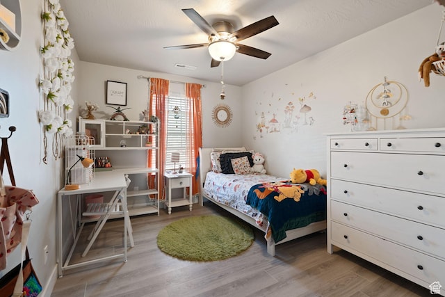 7016 N Amber Mead Ave, Eagle Mountain, UT 84005 - bedroom featuring visible vents, wood finished floors, and ceiling fan