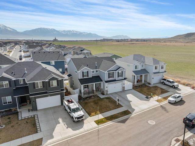 7016 N Amber Mead Ave, Eagle Mountain, UT 84005 - aerial view featuring a mountain view and a residential view